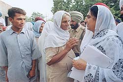 Punjab Agriculture Minister Rajinder Kaur Bhattal listens to the problems at  Harikishanpura village in Bathinda on Sunday.