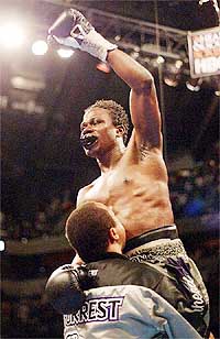 World Boxing Council welterweight champion Vernon Forrest is carried around the ring
