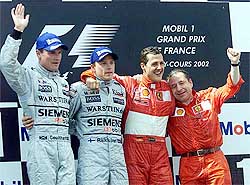 Formula One driver Michael Schumacher of Germany celebrates on the podium