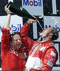 Formula One driver Michael Schumacher of Germany sprays champagne