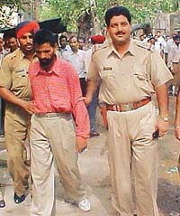 Gian Chand being produced in a court