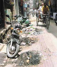 Dirt and filth accumulates in a street