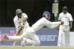 Sri Lanka�s Kumar Sangakkara holds a catch to dismiss Bangladesh batsman Aminnul Islam