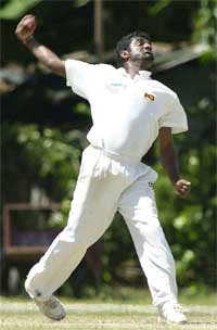 Muttiah Muralitharan bowls on the third day of the first Test against Bangladesh