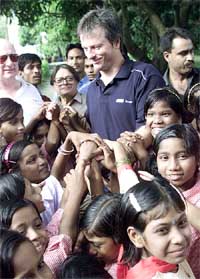 Australian Test cricket captain Steve Waugh interacts with children of leprosy patients