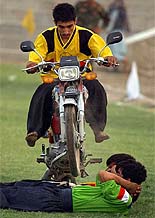 Kandahar's judo team performs a stunt