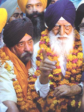 New DSGMC chief Paramjit Singh Sarna with former SGPC chief Gurcharan Singh Tohra at a press conference in the Capital on Wednesday. 