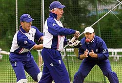 England's trainer Zimbabwean Duncan Fletcher in the nets with his captain Nasser Hussain and vice-captain Alec Stewart