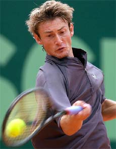 Juan Carlos Ferrero of Spain returns a ball to Irakli Labadze of Georgia during their Austrian Open second round match in Kitzbuehel on Wednesday.