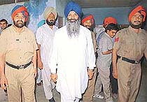 Former Punjab PWD Minister Sucha Singh Langah arrives at a Kharar court