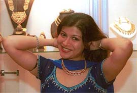 A visitor to Swarn Sambandh, a jewellery exhibition, tries on jewellery