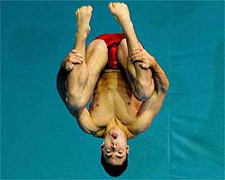 Alexandre Despatie from Canada dives during the men�s one metre springboard preliminaries 
