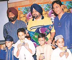 Punjabi pop singer Gurinder Raju along with video director Jagmeet Bal and Rajvir Singh from HMV 