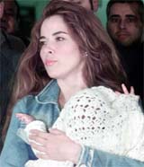 Former Mexican pop star Gloria Trevi holds her son 