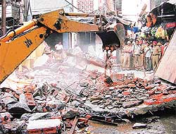 Illegal shops, allegedly belonging to Jagdish Tangri, being demolished