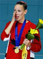 Claire Carver-Dias from Canada cries after receiving her gold medal