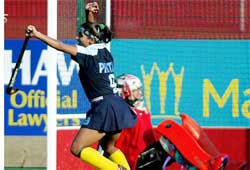 India�s Pritam Siwach celebrates after team-mate Saini Bala scored on Canadian goalkeeper 