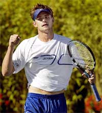 Andy Roddick of the USA celebrates his straight set win over Xavier Malisse