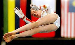 England's Becky Owen performs her routine on the Uneven Bars