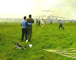 A TV frame from Ukranian television shows a pilot being comforted