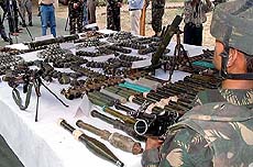 Army personnel display on Sunday huge cache of arms and ammunition