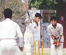Bharat Malhotra of Tony Mahajan XI attempts a shot during a match against Chaman Lal XI at Arya College on Sunday.