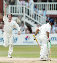 England bowler Simon Jones celebrates bowling out Virender Sehwag