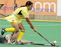 India's Sita Gussain is tackled by New Zealand's Diana Weavers