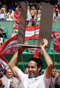 Alex Corretia of Spain lifts the trophy 