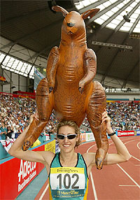 Australia's Kerryn McCann smiles after winning the women's marathon final