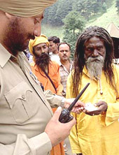 A police officer checks identity papers