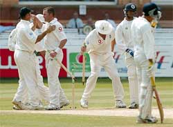 England bowler Andrew Flintoff pulls up a stump 