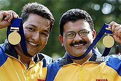 India's Samaresh Jung  and Jaspal Rana celebrate after winning gold 