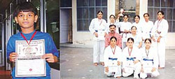 Sahil Verma (left) and the team of Guru Teg Bahadur Hospital that won medals in the fifth National Full Contact Karate Championship at Kapurthala recently. 