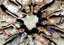 Village urchins smeared with mud pray for rain