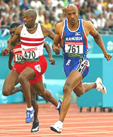 Namibia's Frankie Fredericks beats England's Marlon Devonish to win gold in the men's 200 metres final