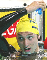 Australia's Ian Thorpe removes his goggles after winning his heat in the men's 400 metres freestyle heats at the 2002 Commonwealth Games in Manchester