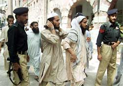 Al-Qaida supporters leave a jail in Lahore on Tuesday