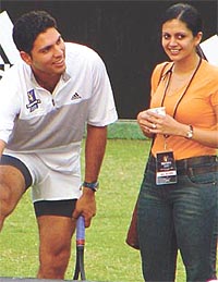 Yuvraj Singh shares a joke with television actress Mandira Bedi 