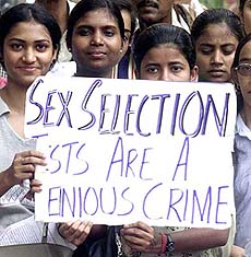 Students of Delhi University hold a placard 