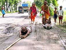 Devotees crawl on their chest