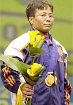 Kunjarani Devi poses with her three gold medals