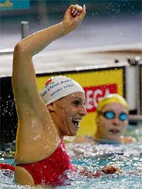 England's Sarah Price  celebrates swimming a new Commonwealth Games record