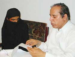 Public prosecutor Ramzan Khalid Joiya gives legal advice to gang-rape victim Mukhtaran Mai