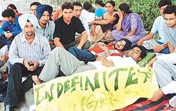 Activists of SOPU on an indefinite fast in support of their demands lie outside the office of the Vice-Chancellor, Panjab University, Chandigarh, on Thursday.