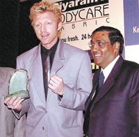 Tennis legend Boris Becker with a memento