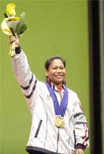 India�s Sanamacha Chanu poses with her three gold medals