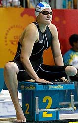 South Africa's Natalie du Toit sits on the blocks before the start of her 800m freestyle heat