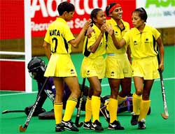 New Zealand�s keeper Helen Clarke is left on the ground