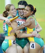 Australia's Lauren Hewitt , Jana Pittman and Cathy Freeman embrace following their gold medal victory